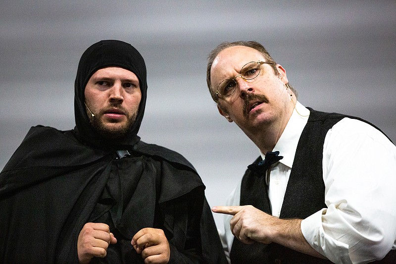 Ethan Weston/News Tribune Michael Brand as Igor, left, and Ben Miller as Dr. Frederick Frankenstein pause during a song they perform together in the play "Young Frankenstein" on Tuesday, Oct. 5, 2021 in Jefferson City, Mo. The pair are part of Capital City Productions.