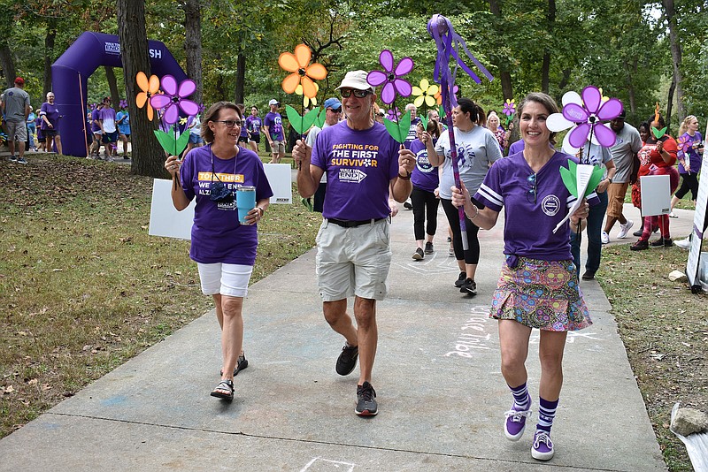 Gerry Tritz/News Tribune photo: 
Emcee Christa Roehl, right, starts off the 2021 Walk to End Alzheimer's at Memorial Park.