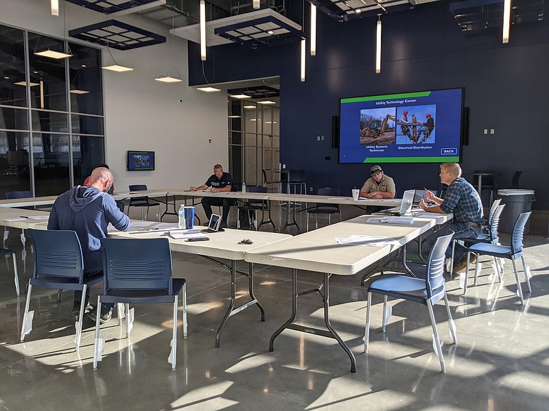 Cole Schaefer (right) meets with utility system professionals as the Utility Systems Technician Department chairman during the advisory council meeting Friday. Schaefer provided updates on program enrollment and curriculum developments, and discussed industry changes, with the campus visitors. 