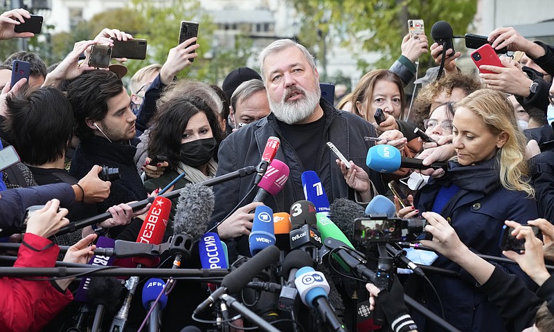 Novaya Gazeta editor Dmitry Muratov talks to media at the Novaya Gazeta newspaper, in Moscow, Russia, Friday, Oct. 8, 2021. The 2021 Nobel Peace Prize has been awarded to journalists Maria Ressa of the Philippines and Dmitry Muratov of Russia. The Norwegian Nobel Committee cited their fight for freedom of expression, stressing that it is vital in promoting peace. (AP Photo/Alexander Zemlianichenko)