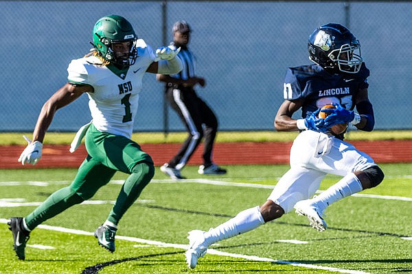 Lincoln wide receiver Aderias Ealy sprints downfield followed by Northeastern State defensive back Bryce Brown during a game last month at Dwight T. Reed Stadium.