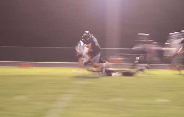 Senior Zeke Gilman sacks the Wright City quarterback in the first half of Friday's game between North Callaway and Wright City.