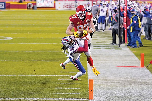 In this Jan. 24 file photo, Chiefs tight end Travis Kelce dives toward the end zone past Bills cornerback Josh Norman during the AFC Championship Game at Arrowhead Stadium.