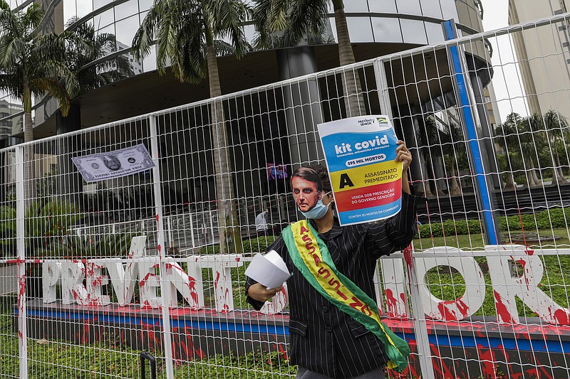 <p>AP</p><p>A demonstrator wearing a mask of Brazilian President Jair Bolsonaro protests against the Prevent Senior health care company Sept. 30 outside of its headquarters in Sao Paulo, Brazil. Whistleblowing doctors, through their lawyer, testified at the Senate last week that Prevent Senior enlisted participants to test unproven drugs without proper consent and forced doctors to toe the line on prescribing unproven drugs touted by President Jair Bolsonaro as part of a “COVID kit,” in the treatment of the new coronavirus.</p>