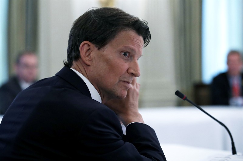 FILE - Brian Goldner, chairman of the board and CEO of Hasbro, listens as President Donald Trump speaks during a roundtable with industry executives about reopening the country after coronavirus closures, in the State Dining Room of the White House, Friday, May 29, 2020, in Washington. Toymaker Hasbro Inc. announced Sunday, Oct. 10, 2021, that Goldner is taking a medical leave of absence from his CEO role, effective immediately. The move follows Goldner's disclosure in August 2020 that he was undergoing continued medical treatment for cancer since 2014.  (AP Photo/Alex Brandon, File)