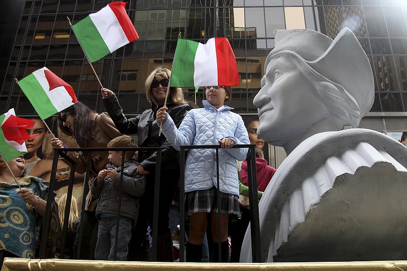 <p>AP File</p><p>People ride on a float with a large bust of Christopher Columbus Oct. 8, 2012, during the Columbus Day parade in New York. Today’s federal holiday dedicated to Christopher Columbus continues to divide those who view the explorer as a representative of Italian Americans’ history and those horrified by an annual tribute that ignores the native people whose lives and culture were forever changed by colonialism.</p>