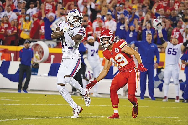 Bills wide receiver Stefon Digg catches a pass for a first down as Chiefs safety Daniel Sorensen defends during Sunday night's game at Arrowhead Stadium.