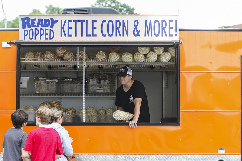 News Tribune file photo: Customers approach Ready Popped during a 2020 Food Truck Friday in front of the Miller Performing Arts Center.