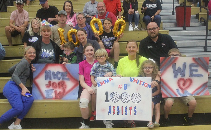 Democrat photo/Evan HolmesEmma Whitson's family and friends help her celebrate her 1,000th career assist before last Tuesday night's match.