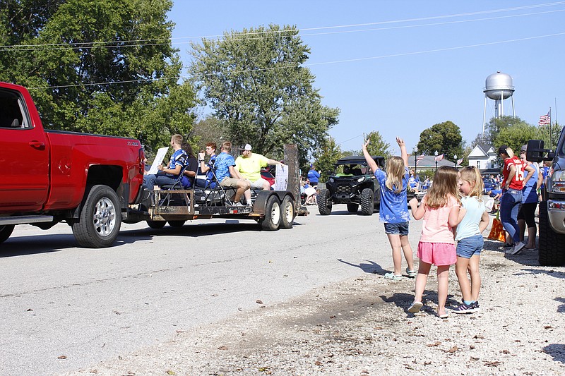 <p>Democrat photo/Austin Hornbostel</p><p>Community members lined the roadways Friday afternoon as the first-ever Russellville Homecoming parade snaked through the streets.</p>