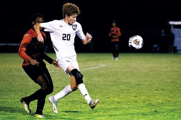 Nick Ammons of Helias passes the ball during Tuesday night's game against Jefferson City at the 179 Soccer Park.