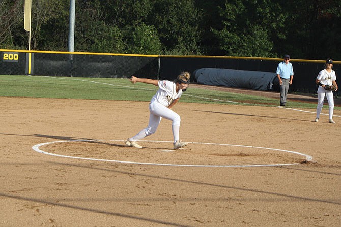 Freshman pitcher Miley Hawkins rares back to throw Tuesday during Fulton's 10-0 first round districts win against Moberly. Hawkins finished with a no-hitter and retired the 16 batters she faced.