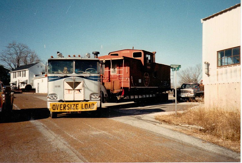 <p>Courtesy/Jim and Eve Campbell</p><p>Jack Casten, an employee of Union Pacific Railroad, was able to secure a Missouri Pacific caboose for the community of Russellville. The caboose was loaded on a trailer in Centertown on Dec. 20, 1988, and moved to Russellville for display in City Park. In 2013, the caboose was moved to Railroad Park in downtown Russellville as part of the town’s 175th anniversary celebration.</p>