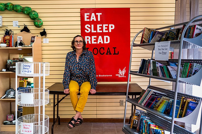 <p>Ethan Weston/News Tribune</p><p>Beth Elliott poses for a photo Tuesday in Downtown Books on High Street. Elliott was the manager for the Capital Mall location before purchasing the High Street location after the Capital Mall location closed.</p>