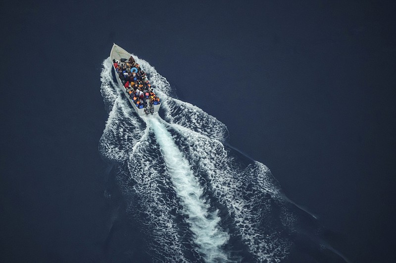 <p>AP</p><p>Migrants navigate an overcrowded wooden boat Saturday in the central Mediterranean Sea between North Africa and the Italian island of Lampedusa, as seen from aboard the humanitarian aircraft Seabird. At least 23,000 people have died or disappeared trying to reach Europe since 2014, according to the United Nations’ migration agency. Despite the risks, many migrants said they’d rather die trying to reach Europe than be returned to Libya.</p>