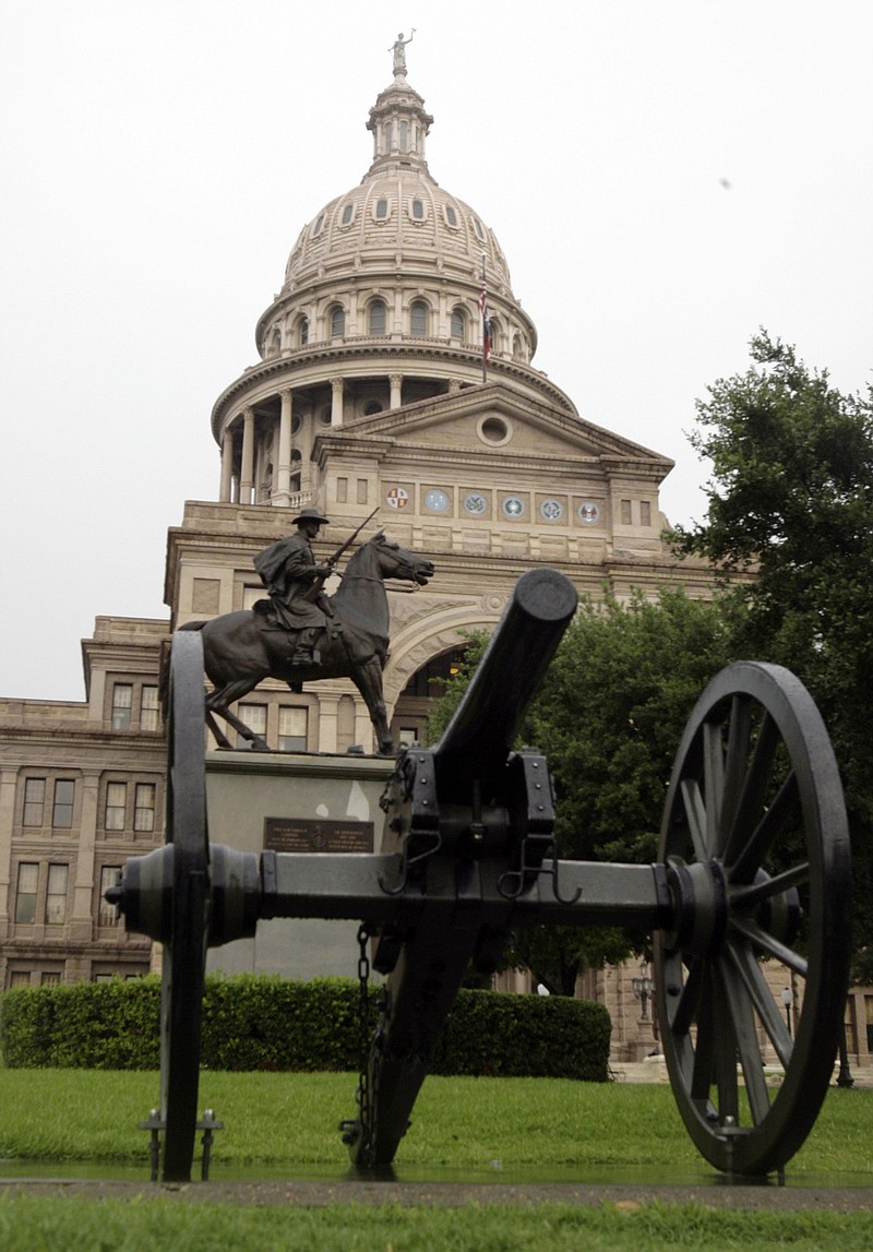 FILE - In this Tuesday, June 30, 2009 file photo, The south side of the Capitol and its surrounding grounds are shown in Austin, Texas. TTexas Republicans are set to approve redrawn U.S. House maps that would shore up their eroding dominance as voters peel away from the GOP in the state’s booming suburbs. The Texas House on Saturday Oct. 16, 2021 is expected to send the maps to Republican Gov. Greg Abbott. (AP Photo/Harry Cabluck, File)