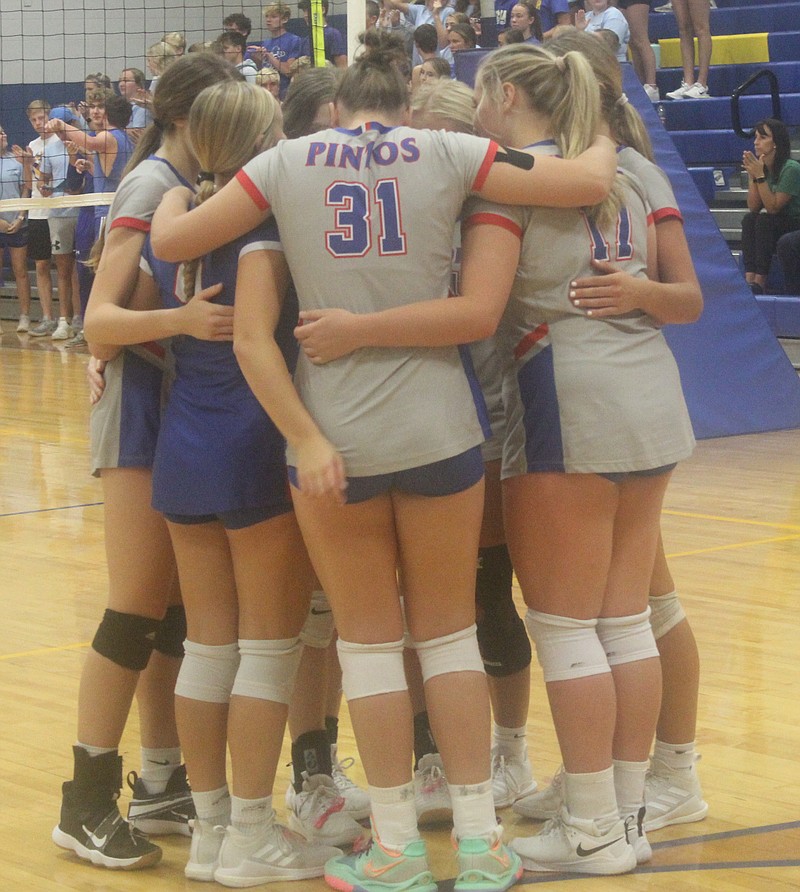 <p>Democrat photo/Evan Holmes</p><p>The Lady Pintos huddle before the opening serve against the Fatima Lady Comets.</p>