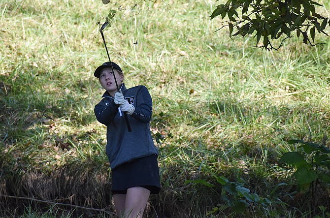 Fulton junior Grace Ousley observes her shot Tuesday at the Class 2 girls golf state tournament at Columbia Country Club. Ousley qualified for state with her teammate, senior Grace Siegel, and finished 33rd while Siegel tied for 35th.
