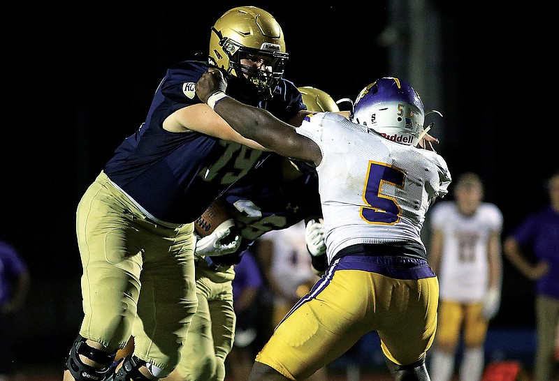 Helias offensive lineman Alex Cook blocks Hickman's Keith Kelley during a game earlier this season at Ray Hentges Stadium.