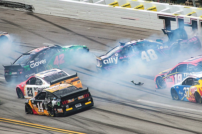 Ross Chastain (42) and Alex Bowman (48) get sideways during a NASCAR Cup series race earlier this month in Talladega, Ala.