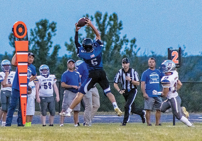 Chris Seaver of Russellville goes up for a pass during a game this season at Russellville.