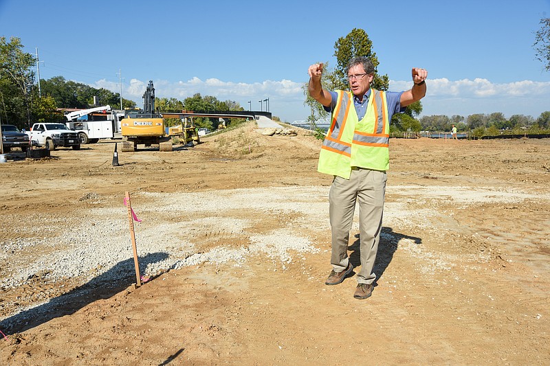 Julie Smith/News Tribune
During a tour of Adrian's Island, City Engineer David Bange talks about placement of items situated around the park, including where the pavers are to go. As part of ongoing fundraising for the project, inscribed pavers will be sold and placed around the walking trails to be constructed.