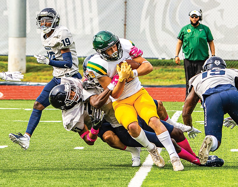 Lincoln's LaMarr Spencer helps bring down Missouri Southern's Nathan Glades during a game earlier this season at Dwight T. Reed Stadium.