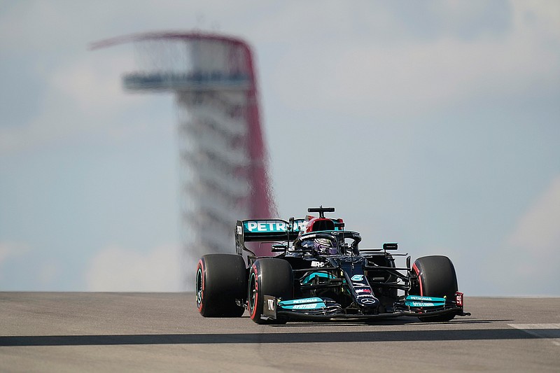 Lewis Hamilton steers through a turn during Friday's practice for the Formula One U.S. Grand Prix at Circuit of the Americas in Austin, Texas.