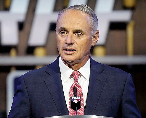 In this July 11 file photo, Major League Baseball commissioner Rob Manfred kicks off the first round of the 2021 draft in Denver. 