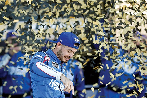 Kyle Larson celebrates Sunday after winning the NASCAR Cup Series race at Kansas Speedway in Kansas City, Kan.