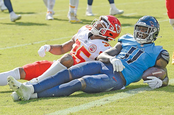 Titans wide receiver A.J. Brown laughs after he was brought down short of the goal line by Chiefs cornerback Charvarius Ward  during Sunday's game in Nashville, Tenn.