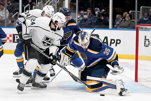 Phillip Danault of the Kings is unable to get the puck past Blues goaltender Ville Husso during the third period of Monday night's game in St. Louis.