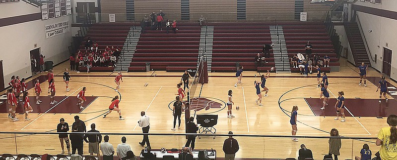 Volleyball players from Jefferson City (left) and Bolivar (right) warm up prior to Tuesday night's Class 4 District 10 Tournament championship match at School of the Osage High School in Osage Beach.