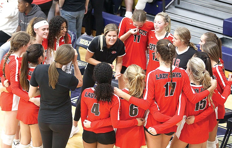 Jefferson City head coach Ali Eskens (center) speaks to the Lady Jays in a huddle prior to a match this season against Helias at Rackers Fieldhouse.