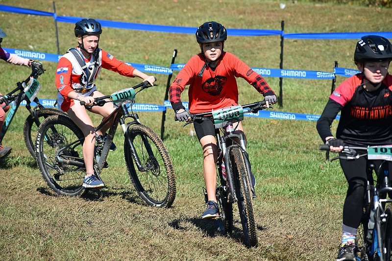 <p>Gerry Tritz/News Tribune</p><p>Allison Skinner, center, of the Central Missouri Lumberjacks, battles with other cyclists Sunday during the Missouri Interscholastic Cycling League State Championship at Binder Lake.</p>