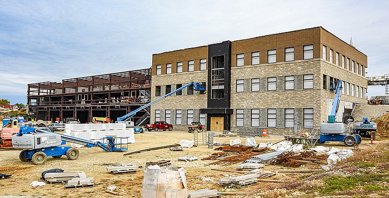 <p>Julie Smith/News Tribune</p><p>Work continues Monday on the new office and warehouse space of the Central Electric Power Cooperative on Jefferson Street. The $26.2 million project will also include parking for utility and service trucks, and storage space. Sircal, a local construction company, is the general contractor for the project.</p>