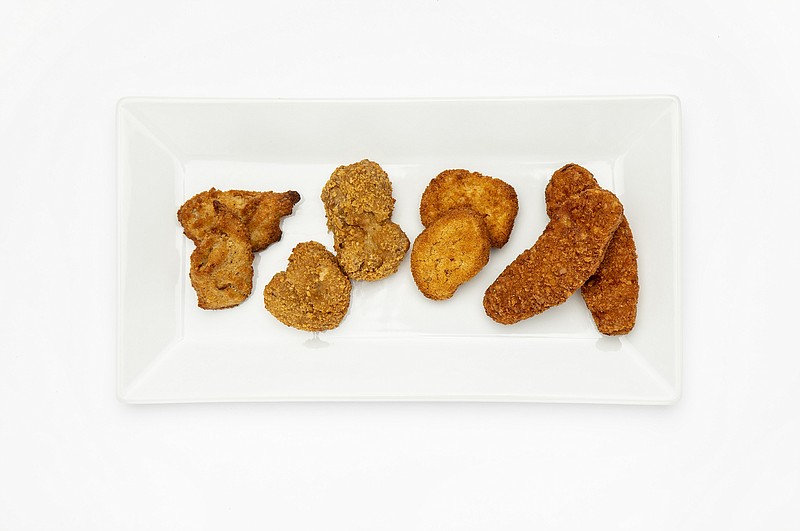 From left, Daring breaded pieces, Nowadays nuggets, Impossible nuggets, Beyond Meat tenders. Plant-based. (Ricardo DeAratanha/Los Angeles Times/TNS)