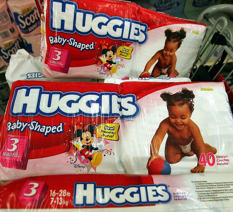 Kimberly-Clark-brand Huggies diapers sit in a shopping cart in a grocery store April 27, 2005 in Chicago. (Tim Boyle/Getty Images/TNS)