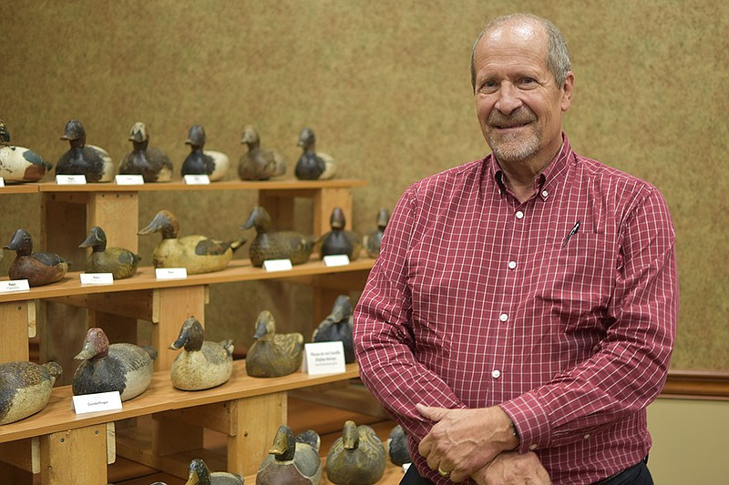 <p>Garrett Fuller/News Tribune</p><p>Dr. Greg Renner stands next to his collection of Hays, Gundelfinger and Benz decoys manufactured in Jefferson City between the early 1920s and 1945. Renner, along with others, have extensively researched the history of decoy and wood products manufacturing in Jefferson City and presented his findings Thursday night at a lecture sponsored by the Historic City of Jefferson in the Clydesdale Room at N.H. Scheppers Distributing.</p>