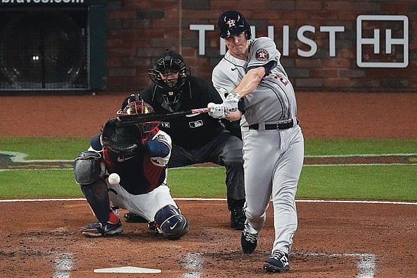 Astros ptitcher Zack Greinke hits a single during Game 4 of the World Series against the Braves last month in Atlanta.