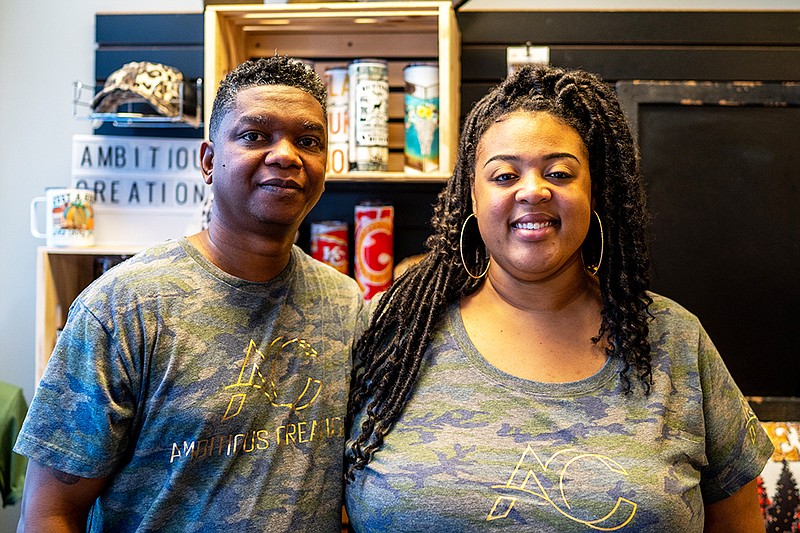 <p>Ethan Weston/News Tribune</p><p>Zederic and Sara Crawford pose for a portrait Thursday at Ambitious Creations in Jefferson City. The pair just moved into a new space and offer services such as screen printing.</p>