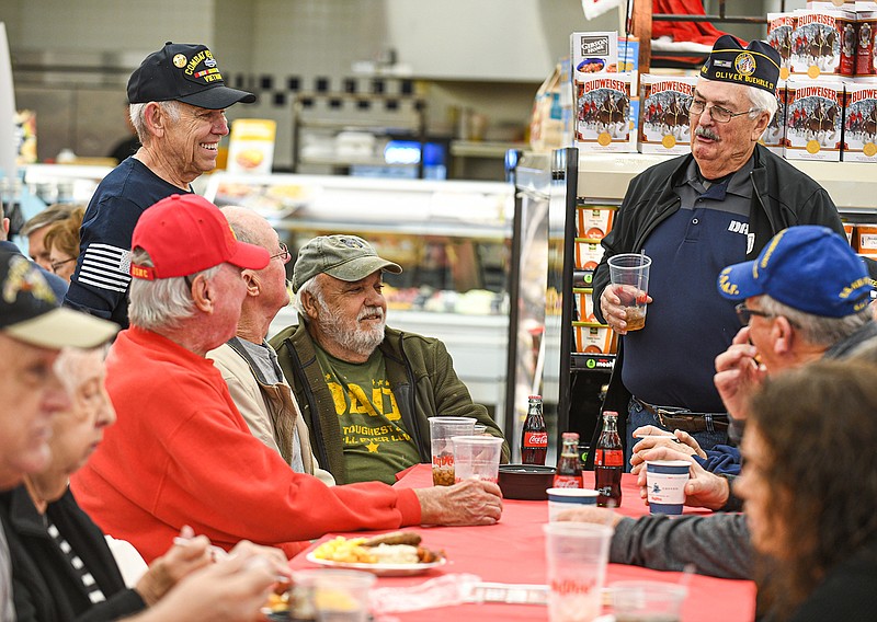 Ron Bogg, standing, greets fellow service members and former schoolmates. There were several in his high school class that served in the military right out of high school and they still try to stay in touch and be there for each other. Bogg is a US Army veteran and joined several hundred other local veterans for breakfast at HyVee, a tradition that is designed to show appreciation to them for their service and to provide an opportunity to join other veterans for a meal if it is only once a year.