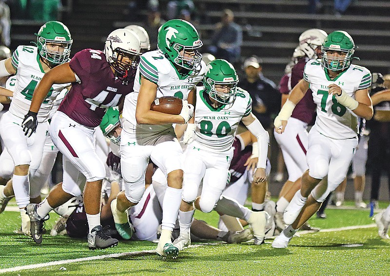 Blair Oaks defensive back Alec Wieberg returns a fumble recovery during a game this season against School of the Osage in Osage Beach.