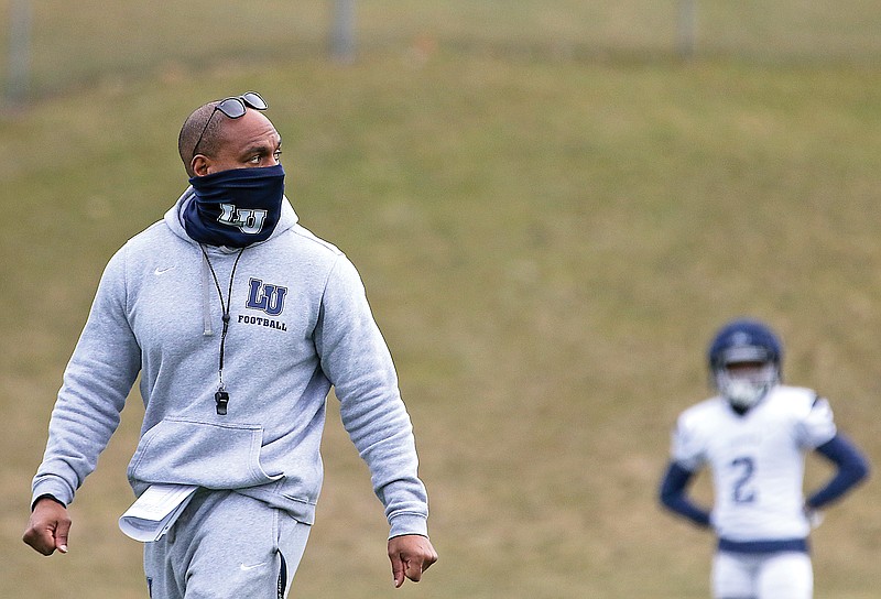 In this Feb. 25 file photo, Lincoln coach Malik Hoskins watches drills during practice at Dwight T. Reed Stadium. Hoskins was fired Sunday after three years as the Blue Tigers' head coach.