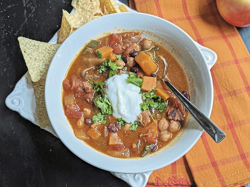 A spicy coconut sweet potato stew is just the thing to take the chill off of a cool autumn evening. (Gretchen McKay/Pittsburgh Post-Gazette/TNS)