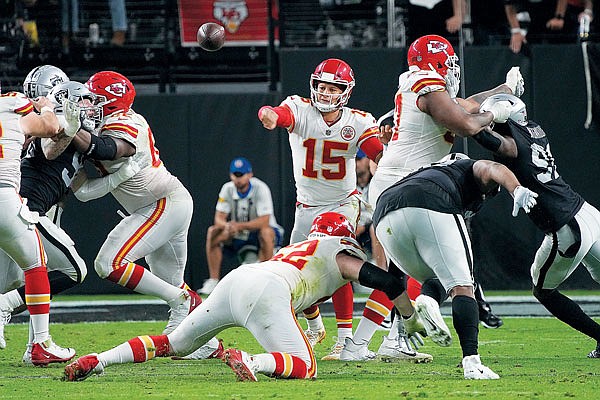 Chiefs quarterback Patrick Mahomes throws a pass during Sunday night's game against the Raiders in Las Vegas.