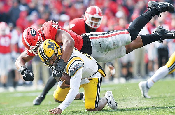 Missouri quarterback Tyler Macon is sacked by Georgia's defensive lineman Travon Walker during a game earlier this month in Athens, Ga.