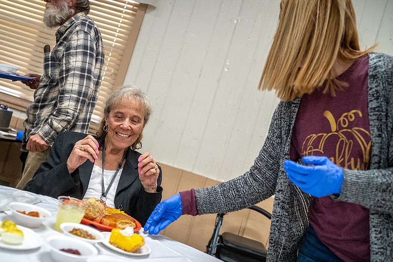 Dee Beck receives her Thanksgiving meal on Thursday, November 18, 2021 at the Holts Summit Civic Center in Holts Summit, Mo. "When we first started here with these meals the crowds were kind of sparse," Beck said. "But now look at it. It's a wonderful thing for this community."