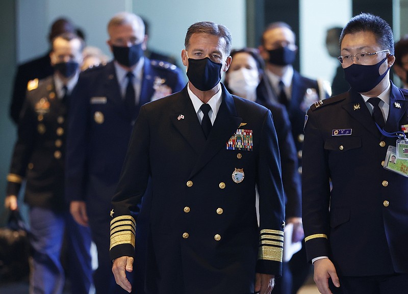 Adm. John Aquilino, center, Commander of the United States Indo-Pacific Command, arrives for a meeting with Japan's Prime Minister Fumio Kishida, not shown, at his official residence in Tokyo, Japan, Thursday, Nov. 11, 2021. (Issei Kato/Pool Photo via AP)