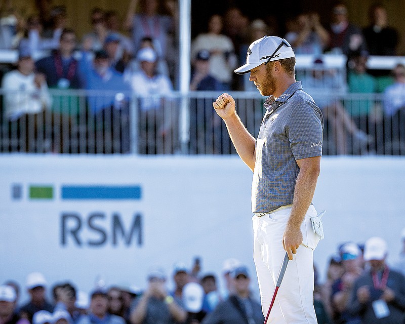 Talor Gooch pumps his fist after sinking his par putt on the 18th hole during Sunday's final round of the RSM Classic in St. Simons Island, Ga.